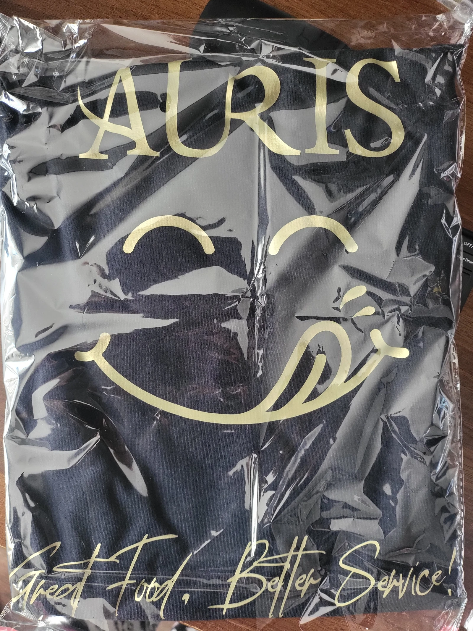 Auris restaurant T-shirt packed